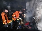 Palestinian firefighters extinguish a fire which broke out in one of the apartments in the Jabalia refugee camp in the northern Gaza strip, on November 17, 2022..(AFP) Palestinian firefighters extinguish a fire which broke out in one of the apartments in the Jabalia refugee camp in the northern Gaza strip, on November 17, 2022..(AFP)