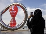 A fan takes a photograph of a countdown clock to the start of the World Cup 