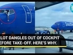 PILOT DANGLES OUT OF COCKPIT BEFORE TAKE-OFF. HERE'S WHY.