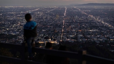 World Population: A boy takes in the view of the Los Angeles skyline. (AP) World Population: A boy takes in the view of the Los Angeles skyline. (AP)