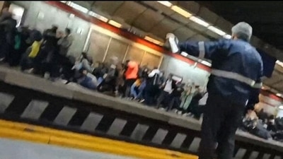Iran Anti-Hijab Protests: Iranians at a metro station in Tehran fleeing and falling down as gunshots are heard. (AFP) Iran Anti-Hijab Protests: Iranians at a metro station in Tehran fleeing and falling down as gunshots are heard. (AFP)