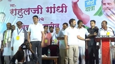 Rahul Gandhi gesturing to the leaders present on the stage after a wrong music started playing instead of National Anthem.