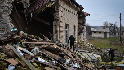 Russia-Ukraine War: A Ukrainian sapper inspects a destroyed building during the demining of a residential area in Novoselivka, Donetsk region. (AP) Russia-Ukraine War: A Ukrainian sapper inspects a destroyed building during the demining of a residential area in Novoselivka, Donetsk region. (AP)