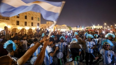 Argentina fans dance with drums at a popular tourist area in Souq Waqif, ahead of the FIFA World Cup 2022 soccer tournament in Doha. (REUTERS)