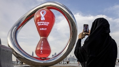 A fan takes a photograph of a countdown clock to the start of the World Cup (REUTERS)