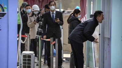 Covid In China: A man has his throat swabbed for a COVID-19 test at a coronavirus testing site in Beijing. (AP) Covid In China: A man has his throat swabbed for a COVID-19 test at a coronavirus testing site in Beijing. (AP)