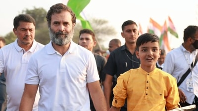 Congress leader Rahul Gandhi with a padayatri during the party's Bharat Jodo Yatra, in Hingoli on Monday. (AICC) Congress leader Rahul Gandhi with a padayatri during the party's Bharat Jodo Yatra, in Hingoli on Monday. (AICC)