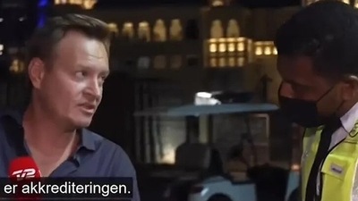 Qatar World Cup: Three men pulled up behind the news anchor in an electric cart.