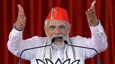 Rajkot, Oct 11 (ANI): Prime Minister Narendra Modi addresses a public rally, at Jamkandorana, in Rajkot Tuesday. (ANI Photo) (ANI)