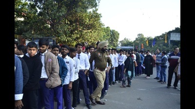Students queue up outside Guru Nanak Stadium on Thursday.) (Harvinder Singh/HT)