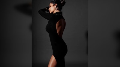 Esha Gupta's silhouette features a turtle neckline, long sleeves with inserted gloves that the hand can be taken out of, a silhouette shaped cut to show off your curves, and a split on one leg. (Instagram/@egupta) Esha Gupta's silhouette features a turtle neckline, long sleeves with inserted gloves that the hand can be taken out of, a silhouette shaped cut to show off your curves, and a split on one leg. (Instagram/@egupta)