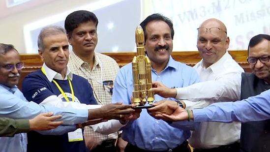 Indian Space Research Organisation (ISRO) Chairman S Somanath with others holds miniature model of rocket LVM3-M2.(Representative Image/ ANI)