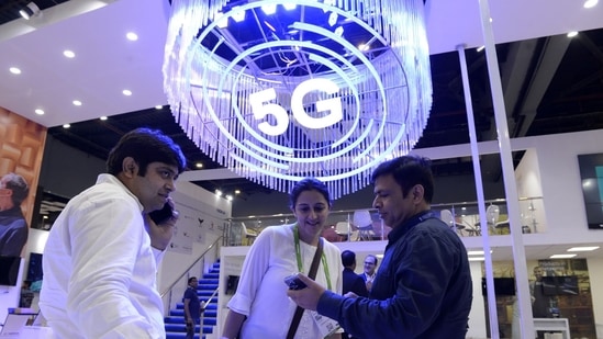 Visitors at India Mobile Congress 2022 exhibition in New Delhi where Narendra Modi, India's prime minister, announced the launch of 5G services in India.(Bloomberg)