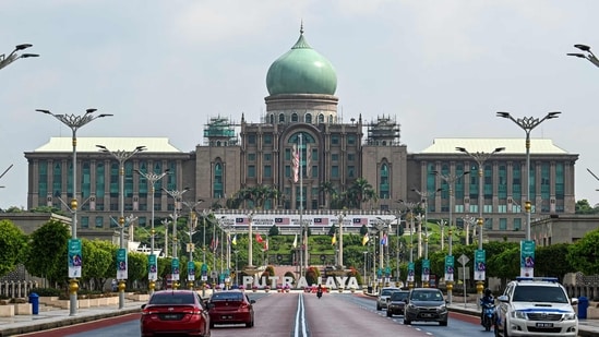 Malaysia Elections Motorists drive on a road in front of the office complex of the Malaysian prime minister in Putrajaya.(AFP)