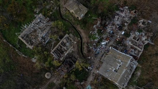 Russia-Ukraine War: A view of a Russian tank and destroyed buildings of a recently liberated village on the outskirts of Kherson. (AP)
