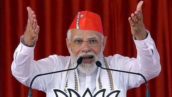 Rajkot, Oct 11 (ANI): Prime Minister Narendra Modi addresses a public rally, at Jamkandorana, in Rajkot Tuesday. (ANI Photo) (ANI)