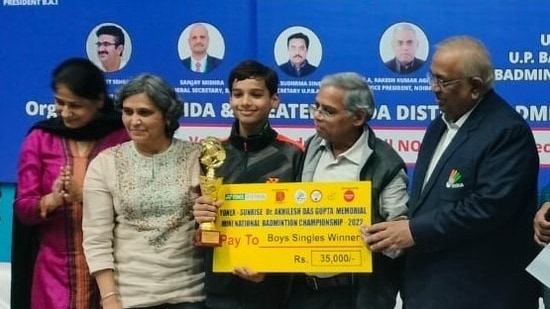 Young Divyansh (centre) poses with the trophy in Noida on Thursday.(BAI) Young Divyansh (centre) poses with the trophy in Noida on Thursday.(BAI)