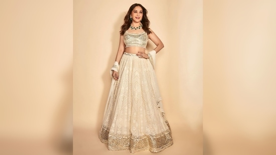 Madhuri Dixit's outfit comes with a sequins sleeveless blouse, a lehenga and a matching dupatta.(Instagram/@madhuridixitnene)