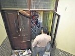 A man on Wednesday takes pictures from the window of the flat where Aaftab Poonawala (inset, above) allegedly murdered Shraddha Walkar in Chhattarpur in New Delhi. (Sanchit Khanna/HT Photo) A man on Wednesday takes pictures from the window of the flat where Aaftab Poonawala (inset, above) allegedly murdered Shraddha Walkar in Chhattarpur in New Delhi. (Sanchit Khanna/HT Photo)