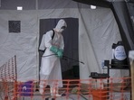 A medical worker disinfects a tent used for suspected Ebola victims inside the Ebola isolation center of Madudu Health Center III, in the village of Madudu, in the Mubende district of Uganda November 1.(AP)