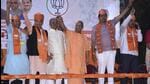 Uttar Pradesh chief minister Yogi Adityanath among others during an election campaign rally for the BJP, ahead of assembly polls, in Surat. (PTI) Uttar Pradesh chief minister Yogi Adityanath among others during an election campaign rally for the BJP, ahead of assembly polls, in Surat. (PTI)