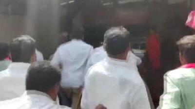 The security personnel at the MP’s residence resisted the TRS workers and informed the police. (ANI video | Screenshot) The security personnel at the MP’s residence resisted the TRS workers and informed the police. (ANI video | Screenshot)
