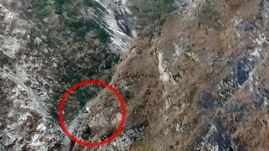 A vehicle carrying 12-13 people fell into a deep gorge from the Dumak road near the village Palla Jakhol, in Chamoli on Friday, as per the SDRF spokesperson, actions being taken to bring the dead bodies from the accident site. (ANI Pic Service)