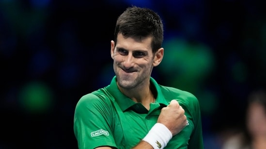 Serbia's Novak Djokovic celebrates after winning against Russia's Daniil Medvedev during their singles tennis match of the ATP World Tour Finals, at the Pala Alpitour in Turin.(AP)