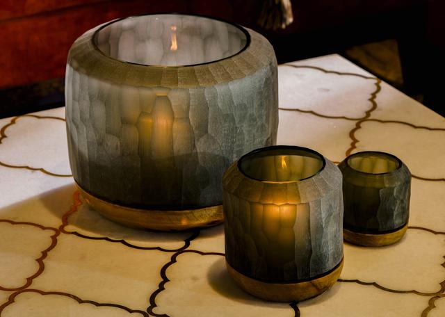 This beautiful set of three luxurious hand blown glass candle holders in a unique ribbed pattern, with a wood base will lend a warm and romantic feel for those cold and long winter nights. (Grey snow candle holders by Izzhaar) This beautiful set of three luxurious hand blown glass candle holders in a unique ribbed pattern, with a wood base will lend a warm and romantic feel for those cold and long winter nights. (Grey snow candle holders by Izzhaar)