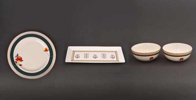 This fine, delicately handcrafted, porcelain tableware comprising of plates, serving platters and bowls have been aesthetically created with Paithani motifs and laced with 24k gold trimmings. (The Valleys of Sahyadri collection by Jaypore This fine, delicately handcrafted, porcelain tableware comprising of plates, serving platters and bowls have been aesthetically created with Paithani motifs and laced with 24k gold trimmings. (The Valleys of Sahyadri collection by Jaypore