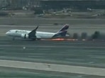 Screengrab of the video showing a few moments after the plane struck a firetruck on runway and caught fire.