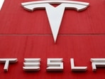 The logo of car manufacturer Tesla is seen at a branch office in Bern, Switzerland.