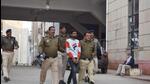 Police personnel take the accused into custody, in Rajasthan. (HT Photo) Police personnel take the accused into custody, in Rajasthan. (HT Photo)