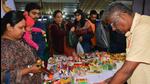 K Rangnathan, a wood-craftsman from Krishnagiri district of Tamil Nadu, at his stall in Varanasi during an exhibition held as part of the Kashi-Tamil Sangamam. (HT Photo) K Rangnathan, a wood-craftsman from Krishnagiri district of Tamil Nadu, at his stall in Varanasi during an exhibition held as part of the Kashi-Tamil Sangamam. (HT Photo)