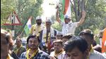 PAAS leaders Alpesh Kathiriya and Dharmik Malaviya during a roadshow as they join AAP in Surat on November 5. (ANI) PAAS leaders Alpesh Kathiriya and Dharmik Malaviya during a roadshow as they join AAP in Surat on November 5. (ANI)