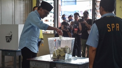 Malaysia Election: Malaysia's opposition leader Anwar Ibrahim, chairman of the Pakatan Harapan (Alliance of Hope), casts his ballot at a polling station during the general election in Permatang Pauh. (AFP) Malaysia Election: Malaysia's opposition leader Anwar Ibrahim, chairman of the Pakatan Harapan (Alliance of Hope), casts his ballot at a polling station during the general election in Permatang Pauh. (AFP)
