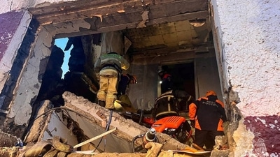 Russia: Rescuers remove debris at an accident scene following the collapse of a residential building in the settlement of Tymovskoye. (Reuters)