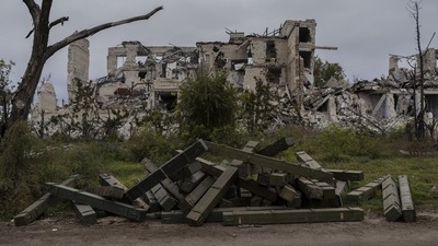 Russia-Ukraine War: Ammunition boxes lay outside a destroyed school on the outskirts of a recently liberated village outskirts of Kherson. (AP) Russia-Ukraine War: Ammunition boxes lay outside a destroyed school on the outskirts of a recently liberated village outskirts of Kherson. (AP)
