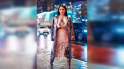Radhika Madan wore a white cropped shirt and a tassel skirt which she paired with a metallic overcoat and over-the-knee boots. (Instagram/@radhikamadan) Radhika Madan wore a white cropped shirt and a tassel skirt which she paired with a metallic overcoat and over-the-knee boots. (Instagram/@radhikamadan)