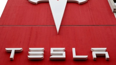 The logo of car manufacturer Tesla is seen at a branch office in Bern, Switzerland. (REUTERS)