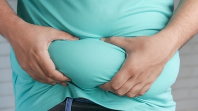 Swollen Belly: If you drink a lot of alcohol and have a swollen tummy then you should consider visiting a doctor since this could be ascites, one of the signs of fatty liver disease. (Unsplash) Swollen Belly: If you drink a lot of alcohol and have a swollen tummy then you should consider visiting a doctor since this could be ascites, one of the signs of fatty liver disease. (Unsplash)