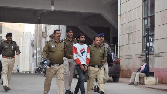 Police personnel take the accused into custody, in Rajasthan. (HT Photo)