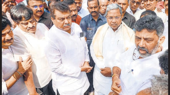 Congress leaders Siddaramaiah, DK Shivakumar and others arrive at the Karnataka Election Commission office to file a complaint against the alleged electoral fraud, in Bengaluru on Saturday. (PTI)