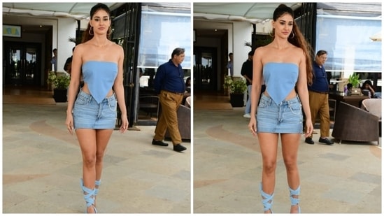 Disha Patani brings back retro fashion with her all blue look. She was spotted wearing an asymmetrical bandeau top, short denim skirt and tie-up heels.(HT Photo/Varinder Chawla)