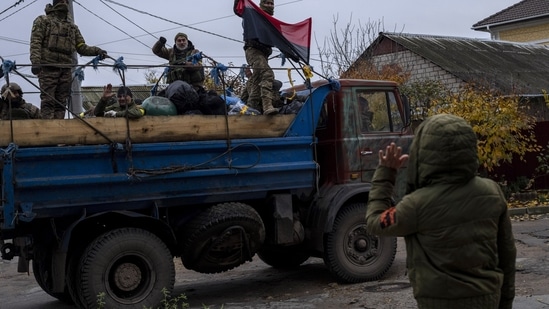 Russia-Ukraine War: A resident waves to Ukrainian security forces in the Kherson area.(AP) Russia-Ukraine War: A resident waves to Ukrainian security forces in the Kherson area.(AP)