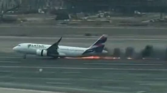 Screengrab of the video showing a few moments after the plane struck a firetruck on runway and caught fire.