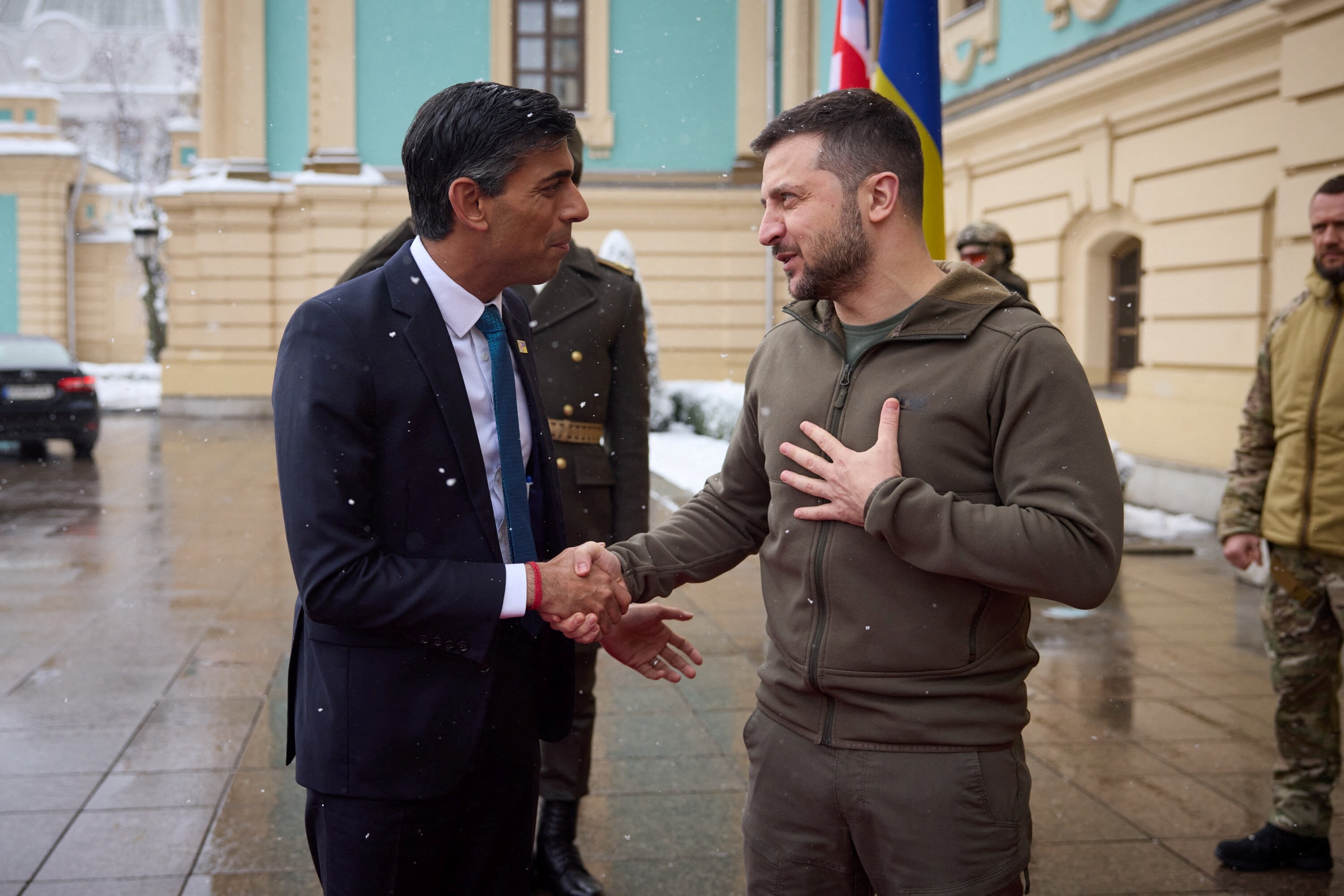 Ukraine's President Volodymyr Zelensky shakes hands with British Prime Minister Rishi Sunak during his welcome, as Russia's attack on Ukraine continues, in Kyiv, Ukraine November 19, 2022. (Ukrainian Presidential Press Service/Handout via REUTERS)