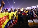 Ecuador fan holding a beer at the opening of the FIFA fan festival
