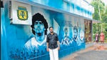 An ardent fan of Argentina, Shinith Patyam painted the outer wall of his house in Kannur district with photos of super stars Maradonna and Messi. (HT Photo) An ardent fan of Argentina, Shinith Patyam painted the outer wall of his house in Kannur district with photos of super stars Maradonna and Messi. (HT Photo)