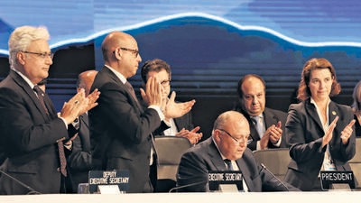 Delegates applaud after COP27 president Sameh Shoukry delivers a statement during the closing plenary at the COP27 climate summit in Egypt on Sunday (REUTERS) Delegates applaud after COP27 president Sameh Shoukry delivers a statement during the closing plenary at the COP27 climate summit in Egypt on Sunday (REUTERS)